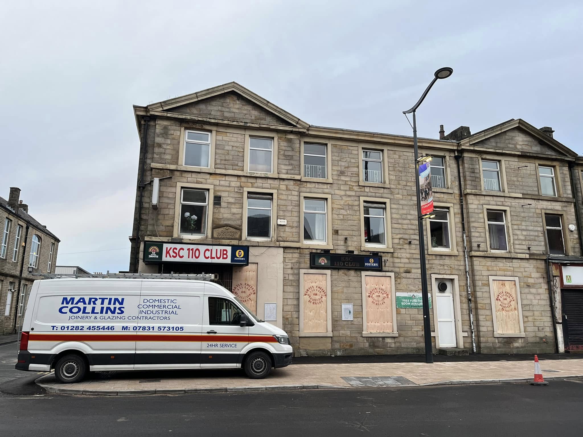 Martin Collins Joinery van in front of boarded up 110 club in Burnley town centre
